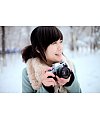 Beautiful girl play photography in winter